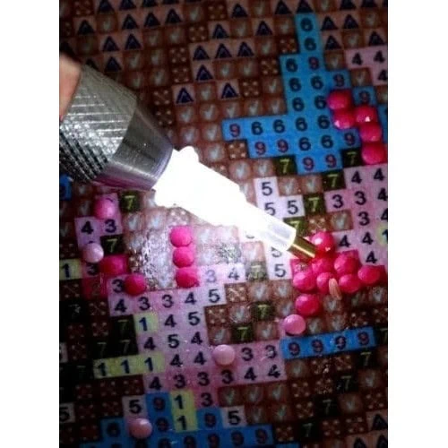 forstørrelsesglas Oplyst pen med forstørrelsesglas og hoveder